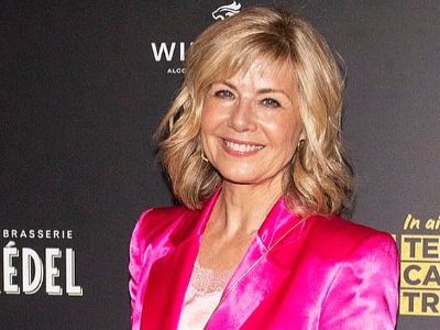 Glynis Barber is wearing a shining pink suit.